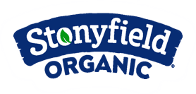 Stonyfield Organic logo with a curved dark blue background. The word "Stonyfield" is written in white with a green leaf inside the letter "o." The word "ORGANIC" is written in all capital letters below in bold dark blue, symbolizing a commitment to healthier choices like a birthday cake for kids.